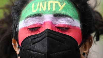 A demonstrator takes part in a solidarity rally for Iranians, in London on Sunday. Reuters