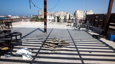 Damage to the rooftop of Al Waddan Hotel after rockets fired by unknown militants fell over Tripoli. EPA