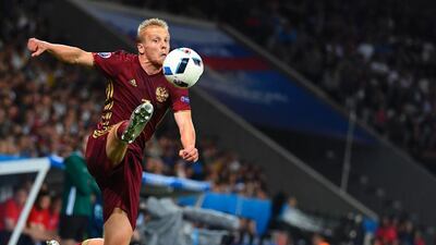 Russia’s defender Igor Smolnikov controls the ball during the Euro 2016 group B football match between Russia and Slovakia at the Pierre-Mauroy stadium in Lille on June 15, 2016. / AFP / Joe KLAMAR