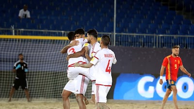 Abbas Ali celebrates with teammate after scoring.