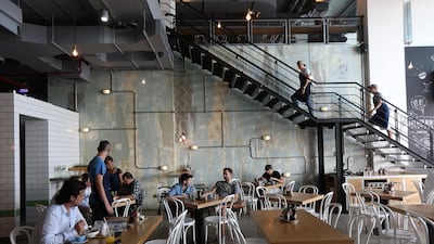 The two-level cafe is gritty and industrial, but still inviting and warm. It’s the kind of cool that appears effortless. Pawan Singh / The National