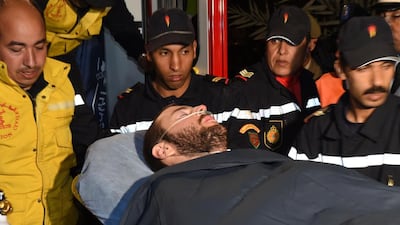 Spanish rescue workers carry a rescued Spanish caver to a clinic in Ouarzazate on April 5, 2015. Only one of three Spanish cavers trapped at the bottom of a deep ravine in Morocco's High Atlas mountains was rescued alive. Fadel Senna/AFP Photo