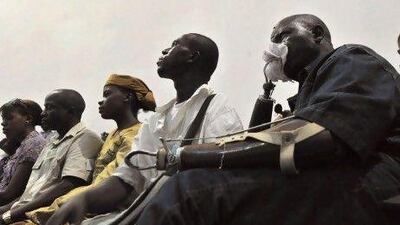 Victims of the civil war in Sierra Leone watch the trial of Liberian ex-leader, Charles Taylor, taking place in The Hague on television in Freetown. Taylor was found guilty of aiding and abetting as well as planning crimes, but he was acquitted of directly ordering crimes.