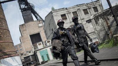 Ukrainian miners at the end of their shift at the Kalinin mine in eastern Ukraine city of Horlivka. In the first quarter, Ukraine produced 5.99 million metric tonnes of coking coal, which is used in steel making, down 4.2 per cent from 6.25 million metric tonnes during the same period of 2013. Evgeniy Maloletka / AP Photo
