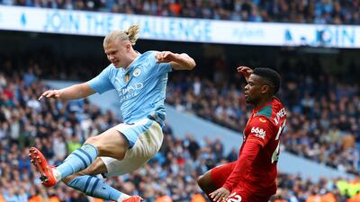 Wolverhampton Wanderers' Nelson Semedo concedes a penalty against Manchester City's Erling Haaland, from which he scored their third. Reuters