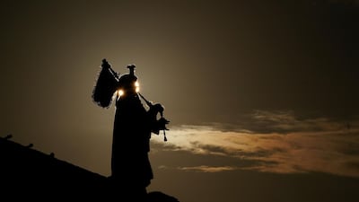 Pipe Major Trevor Macey-Lillie of the Scots Royal artillery stands on a Mulberry harbour as he plays a replica set of Millin-Montgomery pipes on the morning of the 75th anniversary of the D-Day landings in Arromanches Les Bains, France. Getty Images