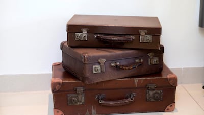 Vintage suitcases piled up in a corner of his home. Ruel Pableo for The National