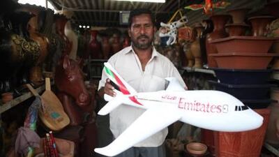 Abdul Salam of Rashid al Abduoli Potter holds an inflatable Emirates airplane. Price: Dh10.