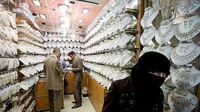 A Syrian woman wears a niqab in Aleppo's old souk.