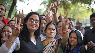 Asha Devi and her lawyer flash victory signs after the executions on March 20, 2020. AP Photo