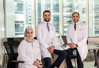 From left, Dr Ghadeer Ghosheh, Dr Mohammad Ghosheh and Dr Humaid Al Shamsi are using the DeepOmic system in a bid to improve cancer treatment. Ruel Pableo for The National