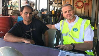 Reverend Andy Bowerman, right, has helped scores of seafarers who have been abandoned by their employers during the Covid-19 pandemic. His role at the Mission to Seafarers involves ensuring medical help, food supplies and fuel is available to forgotten merchant sailors. The National