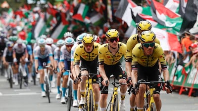 Members of the Visma-Lease a Bike team lead the peleton. EPA