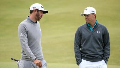 US golfers Dustin Johnson, left, and Jordan Spieth in discussion on the 18th green during the first round of the British Open at the Old Course on July 16, 2015 in St Andrews, Scotland. (Photo by Streeter Lecka/Getty Images)