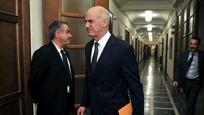 George Papandreou, the Greek prime minister, has held emergency talks with Nicolas Sarkozy and Angela Merkel ahead of the G20 summit in Cannes. AFP