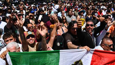 Fans cheer with a Mexico flag for Saul Alvarez during the weigh-in ahead of his fight with Dmitry Bivol. AFP