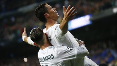 Real Madrid's Cristiano Ronaldo celebrates scoring their third goal and his hat-trick with Sergio Ramos in the Champions League on Tuesday night. Juan Medina / Reuters / April 12, 2016