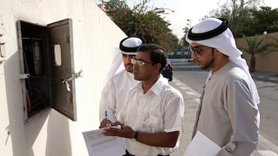 Dewa officers can check the meter and tell customers whether they have a water leak. Jeff Topping / The National