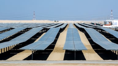 The Al Dhafrah solar park is seen in Abu Dhabi. The UAE has launched several initiatives to support clean energy programmes. Victor Besa / The National