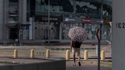 A man shelters from the rain