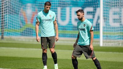 Portugal's Ruben Dias, left, and Bruno Fernandes. EPA