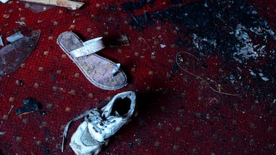 Abandoned shoes at the church. AP