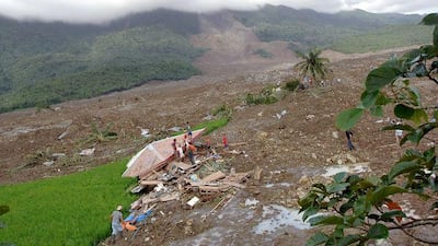 Rescuers and relatives search for survivors and bodies in Guinsaugon in the central Philippines four years ago, after a mudslide swamped the village, killing up to 3,000 people.