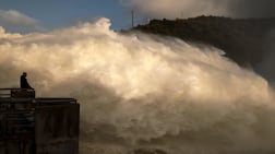 The Alqueva dam discharging water in Moura, Portugal. This week's Storm Leonardo left at least one person dead in Portugal and lashed the southern Spanish region of Andalusia. AFP