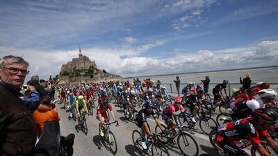 The pack of riders in action by the Mont Saint-Michel during the 1st stage of the 103rd Tour de France between Mont Saint-Michel and Utah Beach, France, 02 July 2016. Kim Ludbrook / EPA