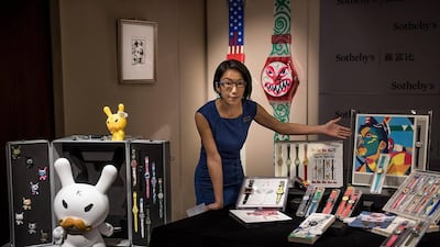 Asia Sotheby’s head of watches, Sharon Chan introduces Paul Dunkel’s Swatch watch collection during the Sotheby’s preview on March 10, 2015 in Hong Kong. Sotheby’s Hong Kong unveils one of the World’s largest private Swatch collections ever known owned by Paul Dunkel. The collection is going for auction on April 7. (Photo by Anthony Kwan/Getty Images)