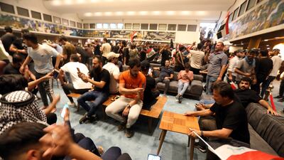 The cleric's followers enter the Parliament building in a show of force. EPA