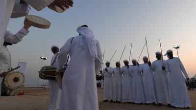 Emirati men perform Al Ayala on Dalma Island.