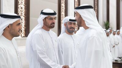 Sheikh Mohamed bin Zayed (right), greets a member of the Ministry of Presidential Affairs, during an iftar reception, at Abu Dhabi's Al Bateen Palace.