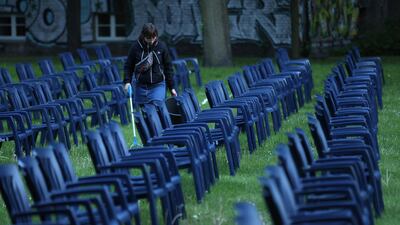 A cinema employee does a last-minute clean before people arrived to watch a film at the Freiluftkino Kreuzberg open-air cinema for the first time this year in Berlin, Germany. Getty Images