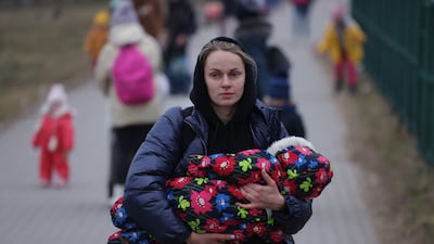 Women and children from war-torn Ukraine arrive in Poland. Getty Images