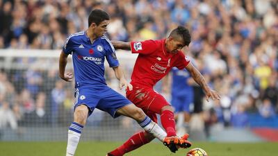 Chelsea's Oscar, left, in action with Liverpool's Roberto Firmino. Reuters / John Sibley