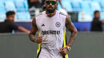 India's Hardik Pandya warms up during a practice session at the Dubai International Stadium. AFP