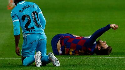 Barcelona defender Gerard Pique grimaces injured against Leganes. AP Photo