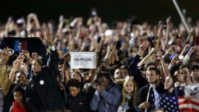Supporters at Chicago's Grant Park react as election results are projected on television monitors at the election night party for the Democratic presidential Barack Obama on Nov 4 2008.