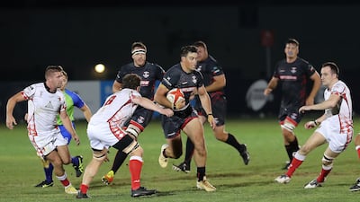 Dubai Exiles run with the ball during the UAE Premiership final.