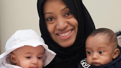 Zakeya Al Ameri with 5-month-old twins Fatima and Ali, at one of the large iftar gatherings with her family. Delores Johnson / The National