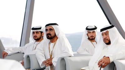 Sheikh Sultan watches the first Abu Dhabi Grand Prix at Yas Marina circuit with Sheikh Mohammed bin Rashid, Vice President and Ruler of Dubai, Sheikh Maktoum bin Mohammed and Sheikh Majid bin Mohammed. Ryan Carter / The National