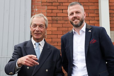 Britain's Reform UK leader Nigel Farage and Makerfield candidate Robert Kenyon. Reuters