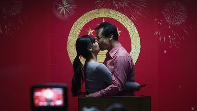 A Chinese couple kiss while being recorded on video during a symbolic ceremony of receiving marriage licenses on Valentine’s Day at a marriage registry office in an eastern district of Beijing, China. Although celebrating February 14 as Valentine’s Day is largely a foreign concept, many Chinese couples are beginning to embrace the idea as a novel day for couples in love to register for marriage. Rolex Dela Pena / EPA
