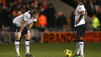 Roman Pavlyuchenko, left, and Jermain Defoe, the Tottenham forwards, look dejected after Blackpool's third goal at Bloomfield Road on Tuesday. Alex Livesey / Getty Images