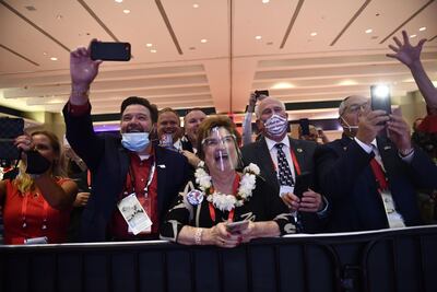 Delegates cheer as US President Donald Trump speaks during the first day of the Republican National Convention in Charlotte, North Carolina on August 24, 2020. AFP / Brendan Smialowsk