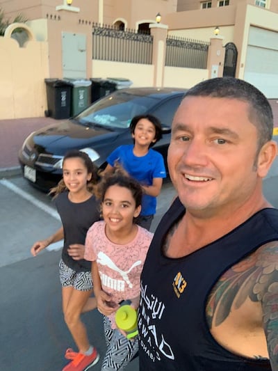 Mr Manning with his three children. Shane Manning