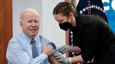 President Joe Biden receives his second Covid-19 booster shot on March 30, 2022, in Washington. AP