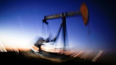 A long exposure image shows the movement of a crude oil pump jack in the Permian Basin in the US. Reuters
