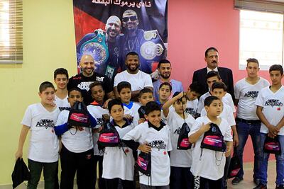 Badou Jack with orphans of Baqa'a refugee camp in Jordan. Courtesy: Badou Jack